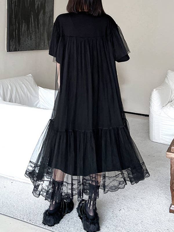 Back view of a black gauzy A-line dress with an edgy design, featuring a flowy silhouette and lightweight fabric, perfect for making a bold statement with a touch of elegance.
