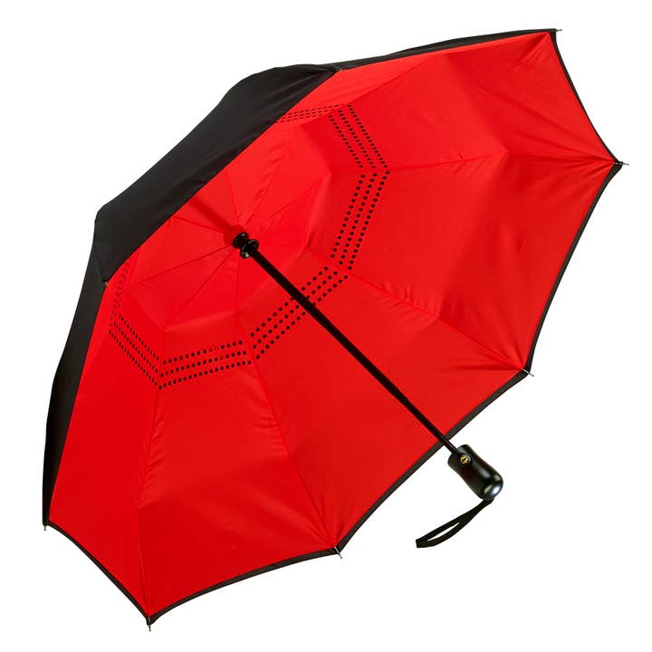 Open black umbrella showcasing the interior vibrant red underside.