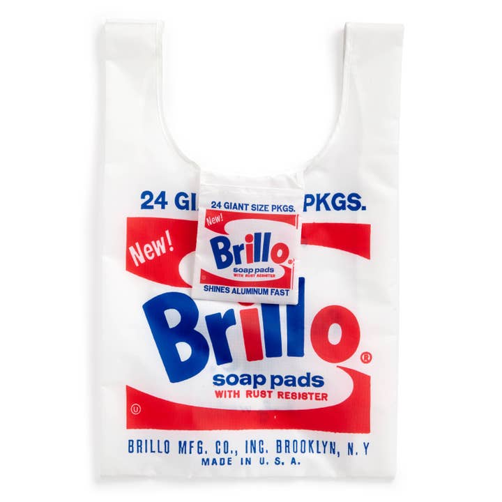 Full view of a reusable tote bag with Andy Warhol's Brillo soap pads design. The bag displays the classic Brillo logo in red and blue on a white background, mimicking the appearance of Brillo packaging.