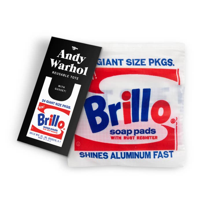 Reusable tote bag inspired by Andy Warhol's Brillo soap pads artwork. The bag features a design resembling the iconic Brillo box art with bold blue and red text and includes an Andy Warhol label attached.