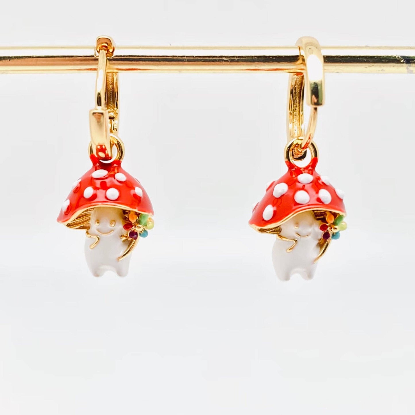 Gold-plated whimsical mushroom enamel earrings in vibrant colors, featuring playful and nature-inspired details, perfect for adding a fun pop of color to any outfit.