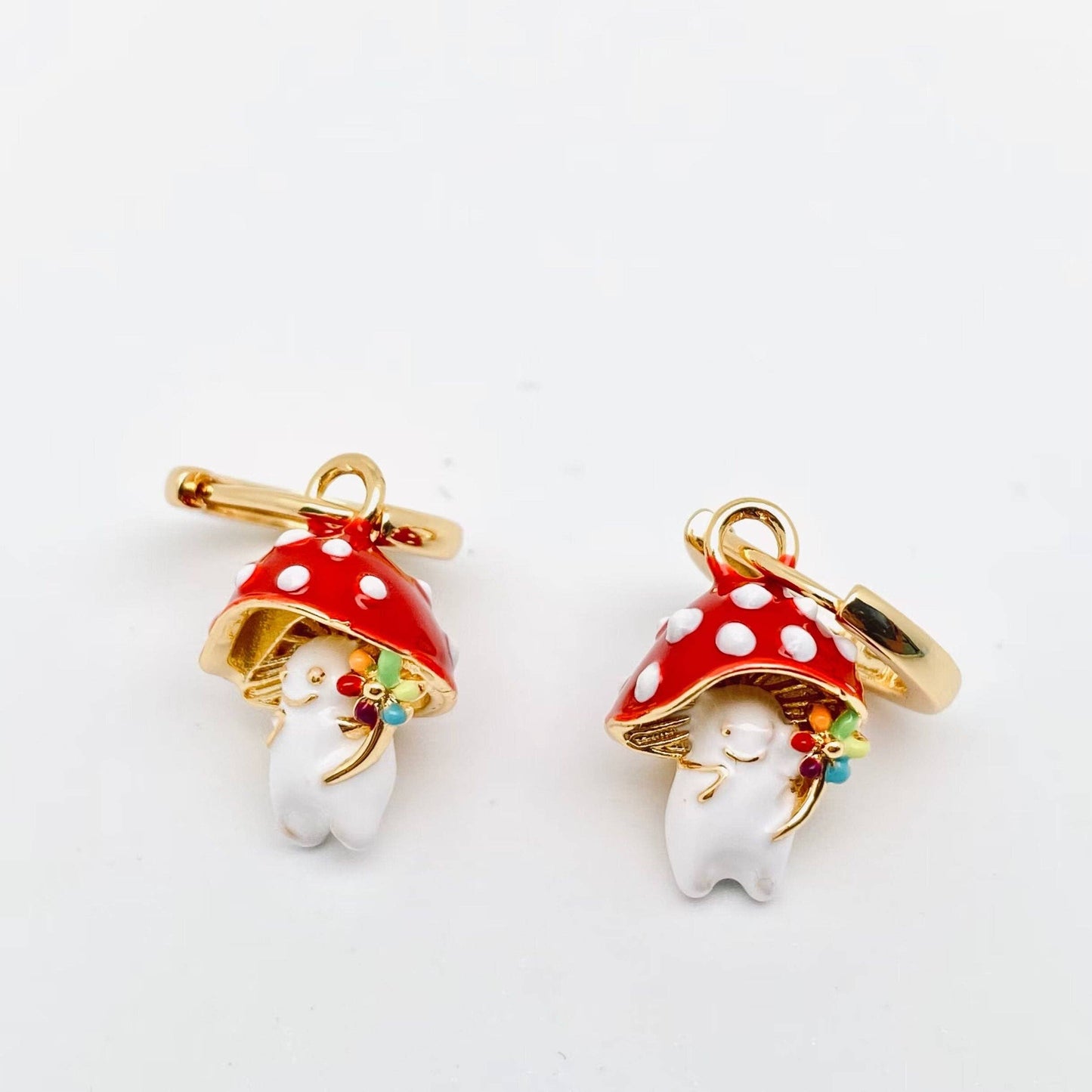 Gold-plated whimsical mushroom enamel earrings in vibrant colors, featuring playful and nature-inspired details, perfect for adding a fun pop of color to any outfit.