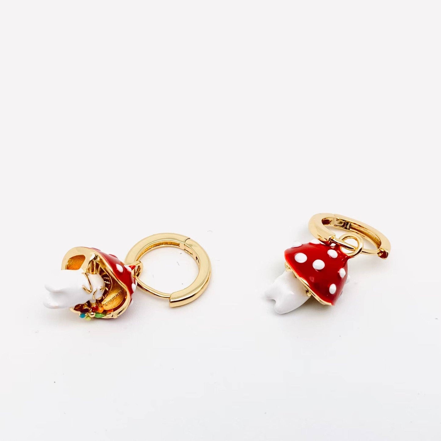 Gold-plated whimsical mushroom enamel earrings in vibrant colors, featuring playful and nature-inspired details, perfect for adding a fun pop of color to any outfit.
