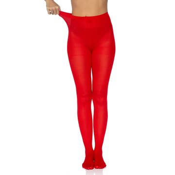 A close-up of vibrant red pantyhose, styled with a skirt and heels for a bold, fashionable look.