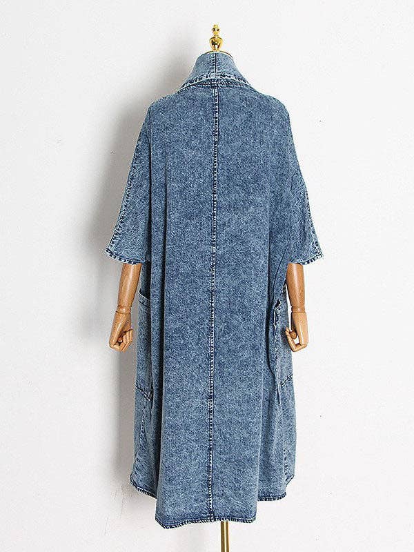 Back view of oversized denim jacket with 3/4 sleeves and large pockets, offering a relaxed fit and stylishly casual vibe.