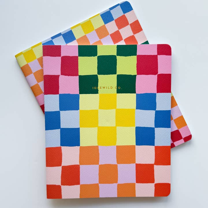 Two rainbow checked, colorful, vibrant notebooks.