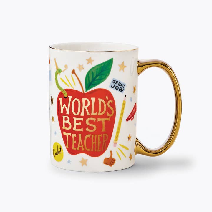 White mug with an apple design and gold-tone handle, featuring the phrase "Best Teacher in the World with handle on the right.