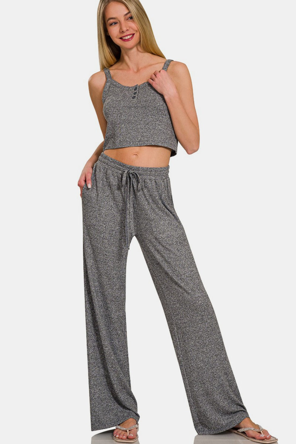 Front view of model wearing a lounging tank top paired with drawstring wide-leg pants with side pockets, featuring a comfortable and stylish design, perfect for casual wear or lounging, made from a soft and stretchy fabric blend.