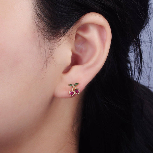 Fuschsia CZ Heart Cherry Earrings worn on an ear