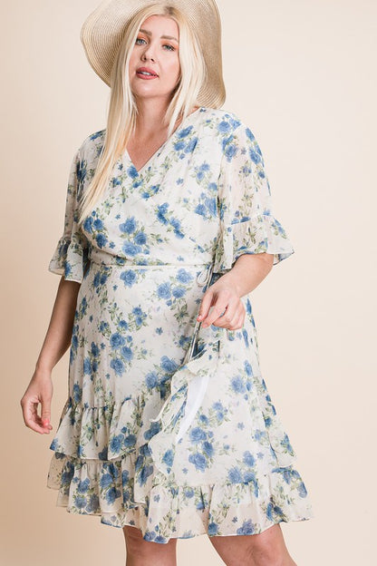 Women's plus size floral wrap dress with blue flower print, ruffle hem, and short sleeves