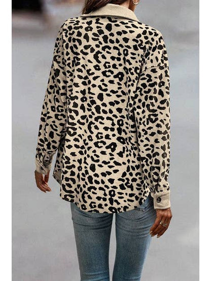 A back view of a beige leopard print jacket, showcasing its loose fit and relaxed style. The jacket is paired with light-wash jeans, giving a casual yet trendy look, ideal for layering during the fall season.