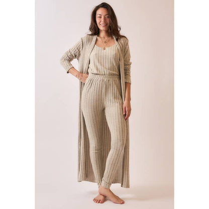 Front view of a soft ribbed long duster cardigan in brushed fabric, styled with matching pieces, featuring a longline silhouette for a cozy and elegant look.