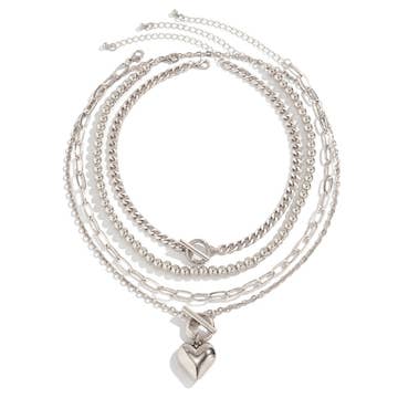 A silver geometric OT buckle heart-shape necklace set laid out flat against a white background.