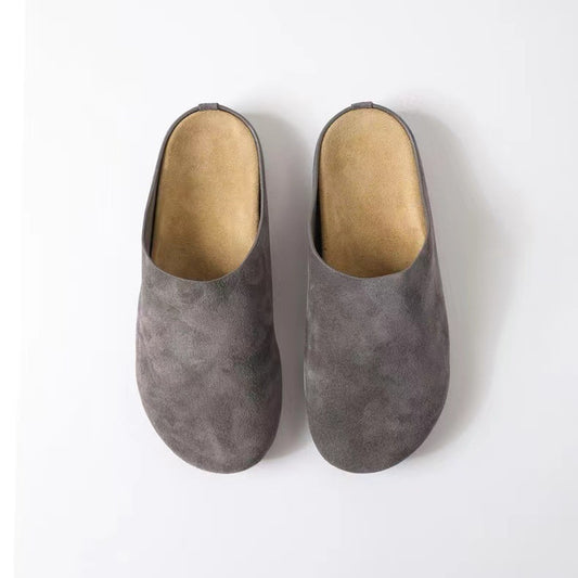 Top View of Suede Round Toe Slip-Ons in grey, offering the perfect blend of style and comfort with a playful heel height. Crafted from durable elastomer and luxurious suede, these imported minimalist flats stand out with their unique design."