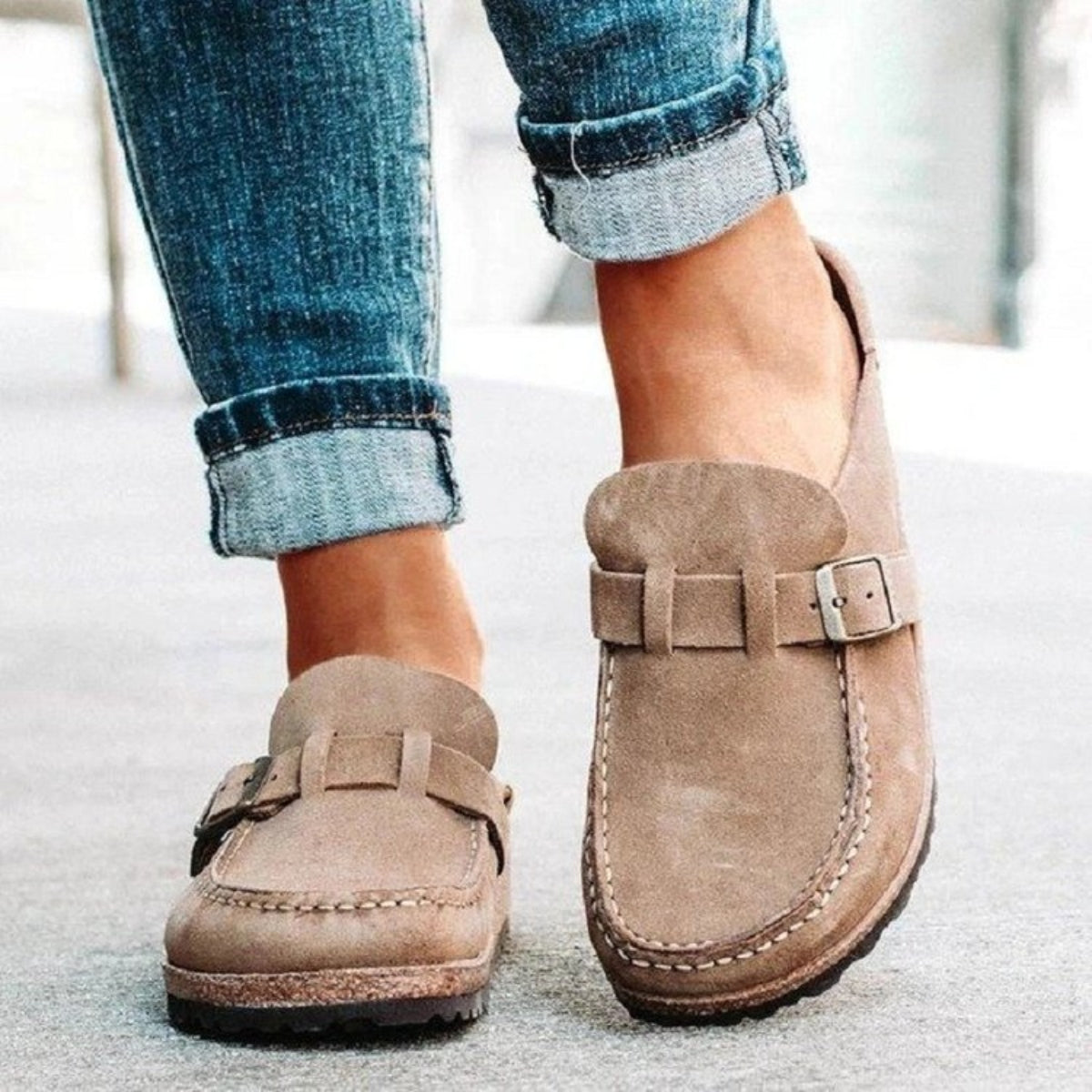 Close-up of a model showcasing stylish Khaki color Round Toe Low Heel Buckle Loafers made from a comfy blend of Elastomer and PU. The loafers feature a unique buckle design and a low heel, adding a playful touch to any outfit, perfect for strutting with confidence.