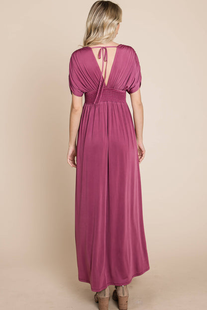 Full body back view of tie-back, flowy empire waist, flowy maxi dress.